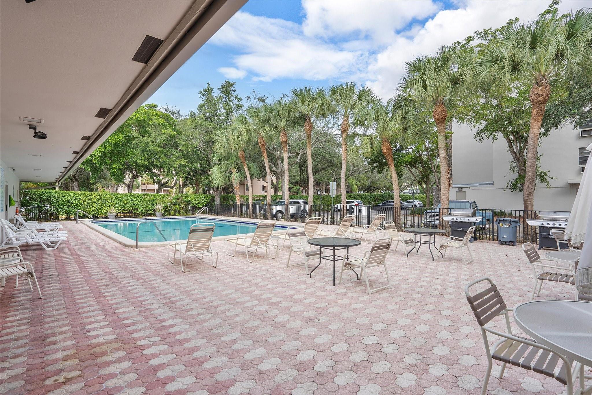 6500 Cypress Road, Unit 211 Plantation, FL 33317 - Photo 37 of 40 a view of a patio with a table and chairs