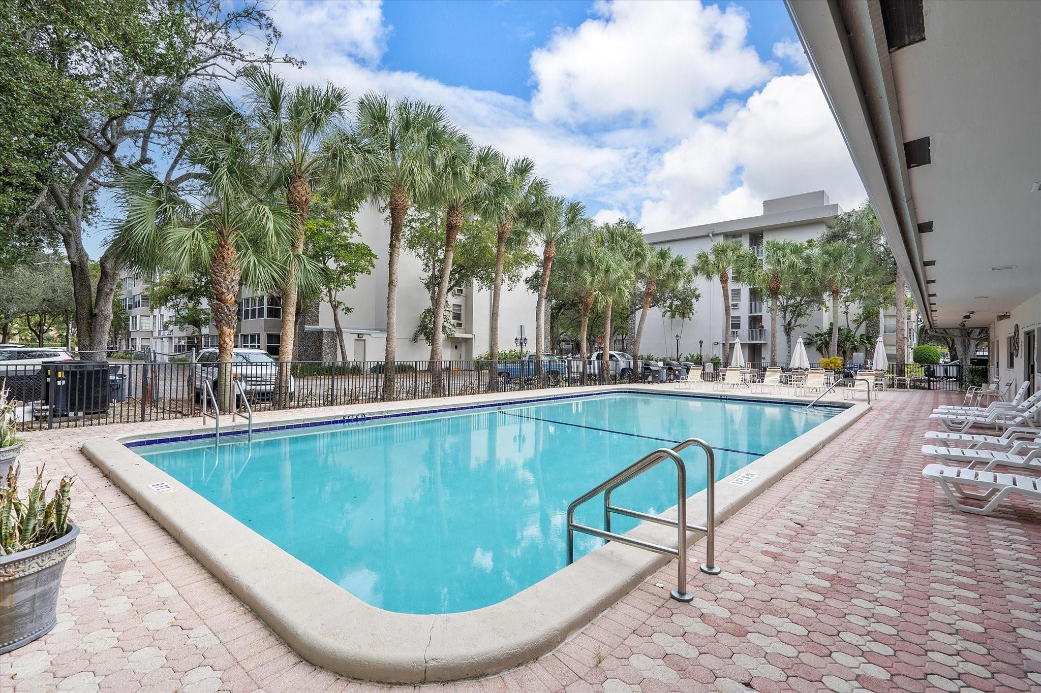 6500 Cypress Road, Unit 211 Plantation, FL 33317 - Photo 38 of 40 a view of outdoor space yard swimming pool and patio