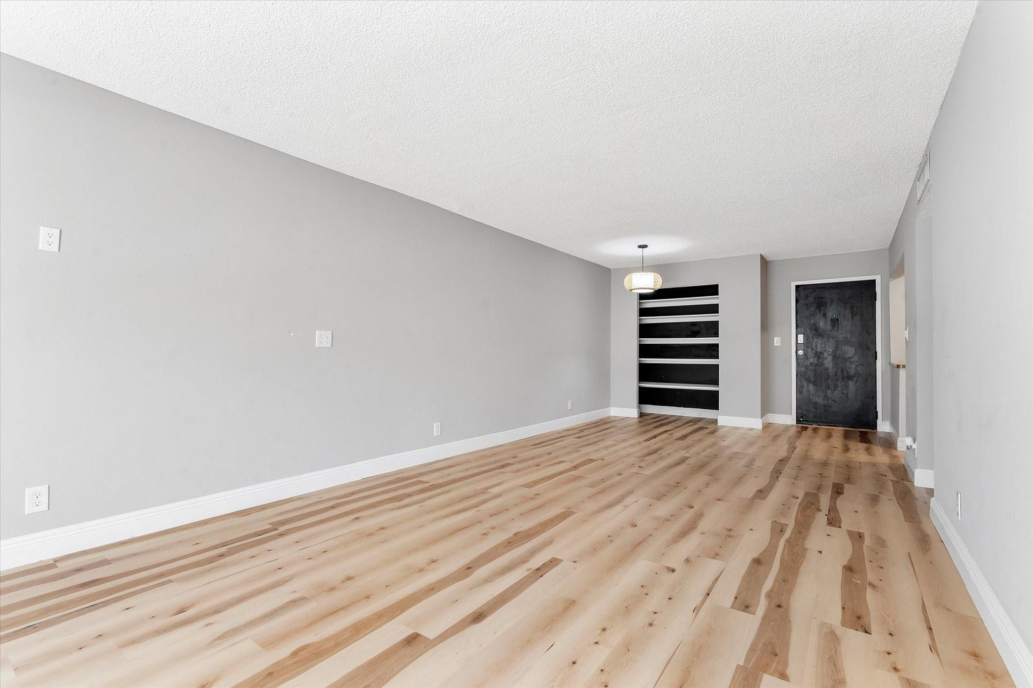 6500 Cypress Road, Unit 211 Plantation, FL 33317 - Photo 6 of 40 a view of empty room with wooden floor and window