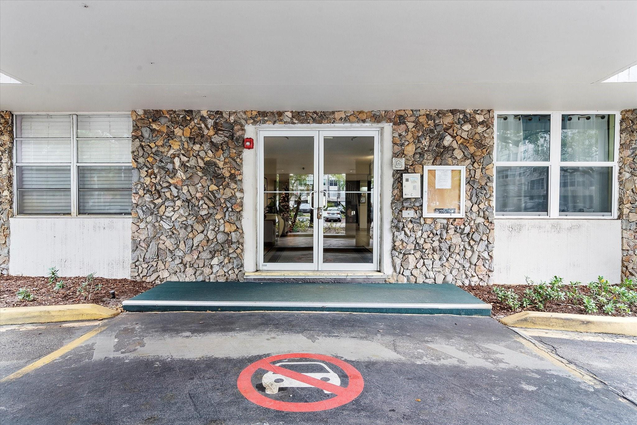 6500 Cypress Road, Unit 211 Plantation, FL 33317 - Photo 10 of 40 front view of a house with a outdoor space