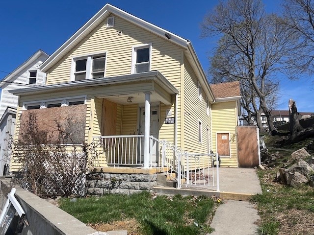 1814 Pleasant Street Fall River, MA 02723 - Photo 1 of 13 a front view of a house with garden