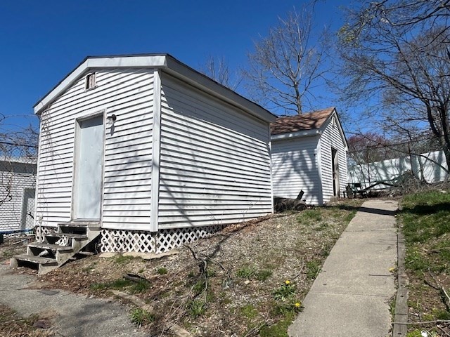 1814 Pleasant Street Fall River, MA 02723 - Photo 5 of 13 a front view of a house with a yard