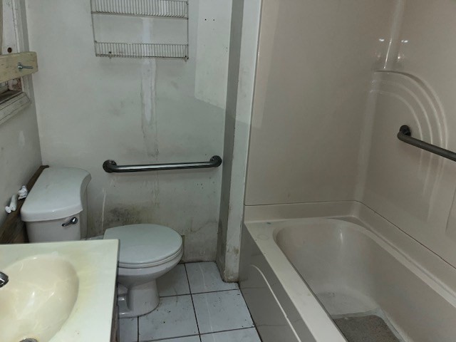 1814 Pleasant Street Fall River, MA 02723 - Photo 9 of 13 a bathroom with a granite countertop toilet and a bathtub