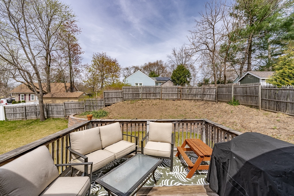 5 Corning Street Springfield, MA 01108 - Photo 11 of 29 a view of a roof deck with couches and wooden fence