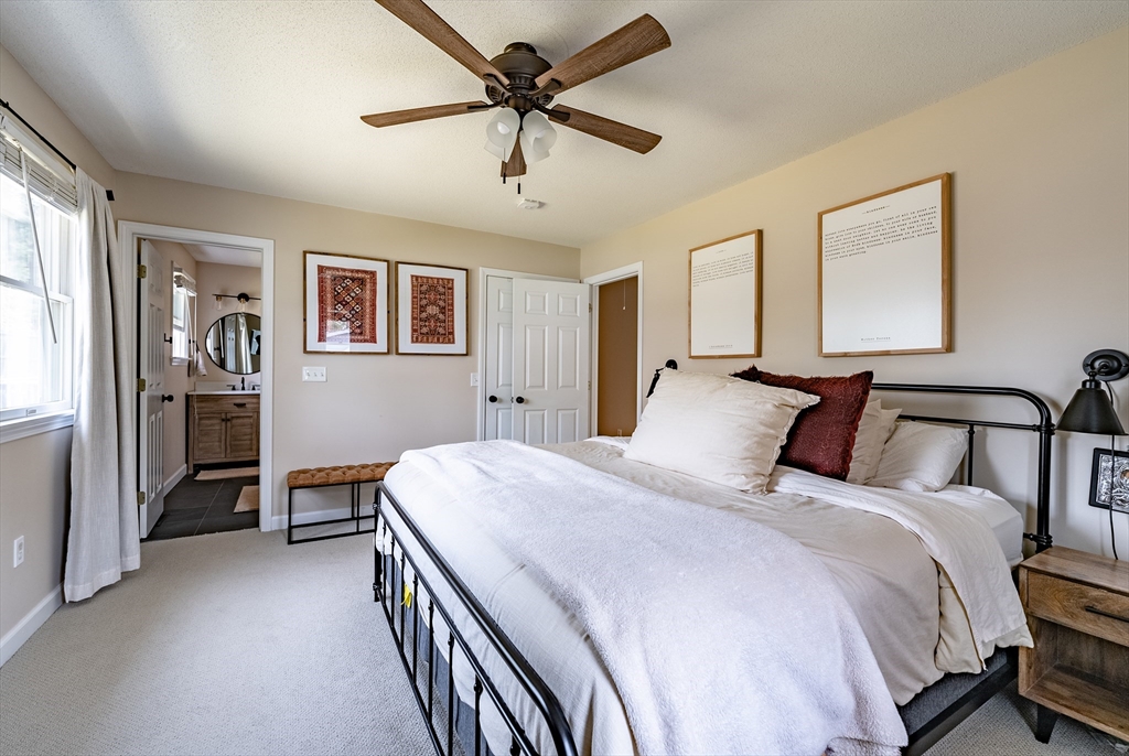 5 Corning Street Springfield, MA 01108 - Photo 15 of 29 a bedroom with a bed and a chandelier