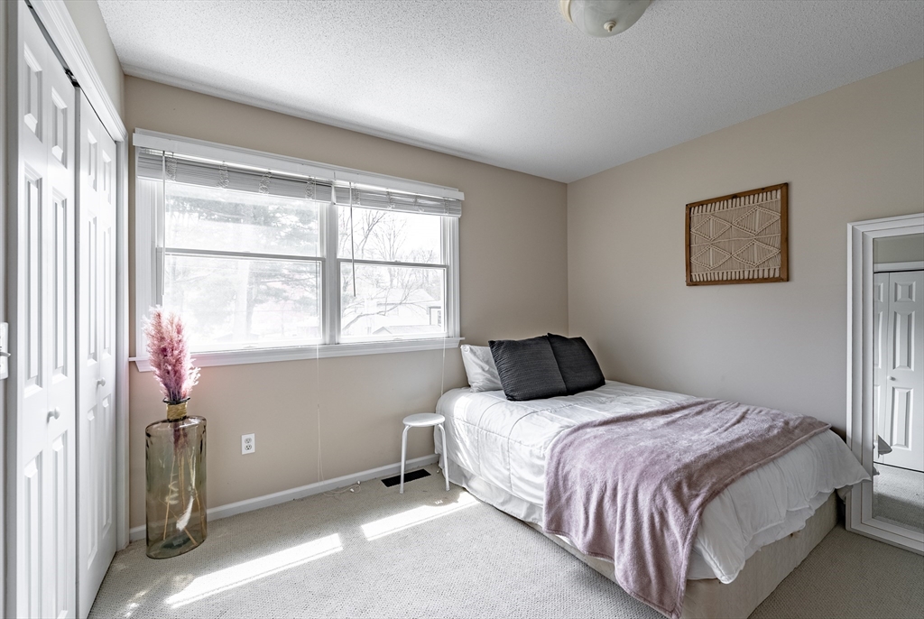 5 Corning Street Springfield, MA 01108 - Photo 18 of 29 a bedroom with a bed and a window