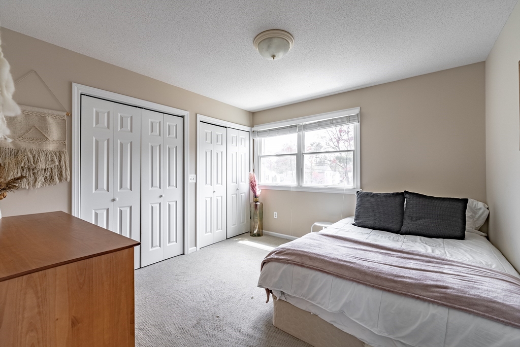 5 Corning Street Springfield, MA 01108 - Photo 19 of 29 a bedroom with a large bed and a window