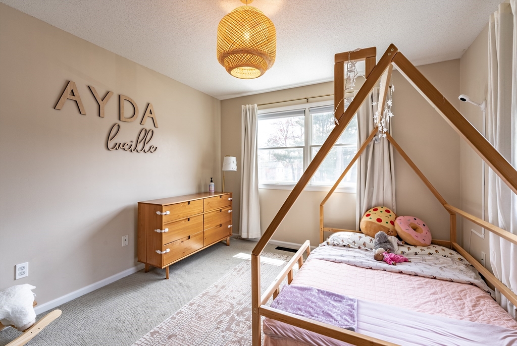 5 Corning Street Springfield, MA 01108 - Photo 21 of 29 a bedroom with a bed and a window