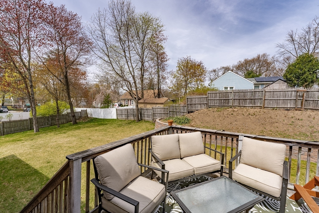 5 Corning Street Springfield, MA 01108 - Photo 27 of 29 a view of a roof deck with couches and wooden fence