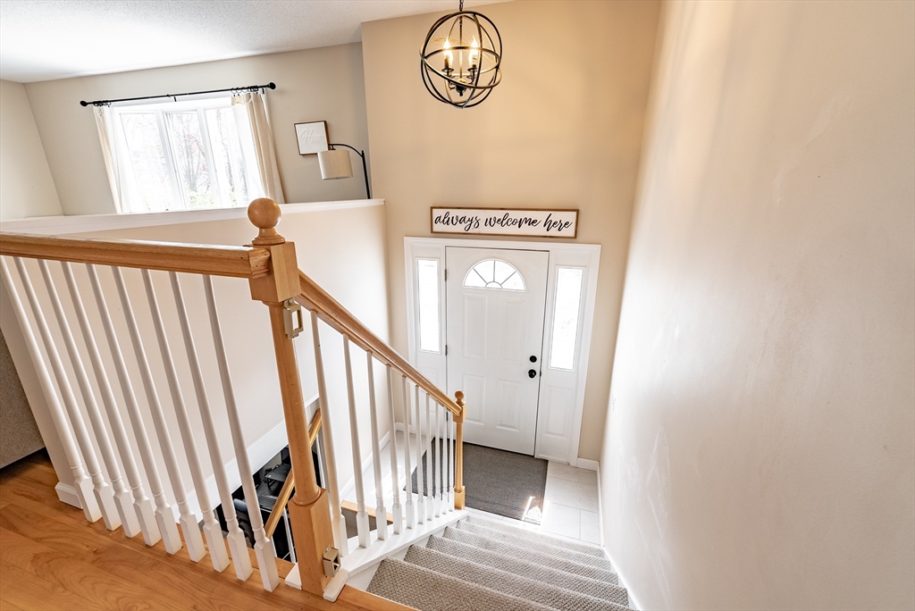 5 Corning Street Springfield, MA 01108 - Photo 3 of 29 a view of a hallway with wooden floor and door