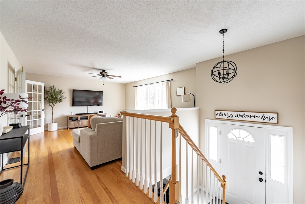 5 Corning Street Springfield, MA 01108 - Photo 4 of 29 a view of a livingroom with furniture wooden floor windows and a chandelier