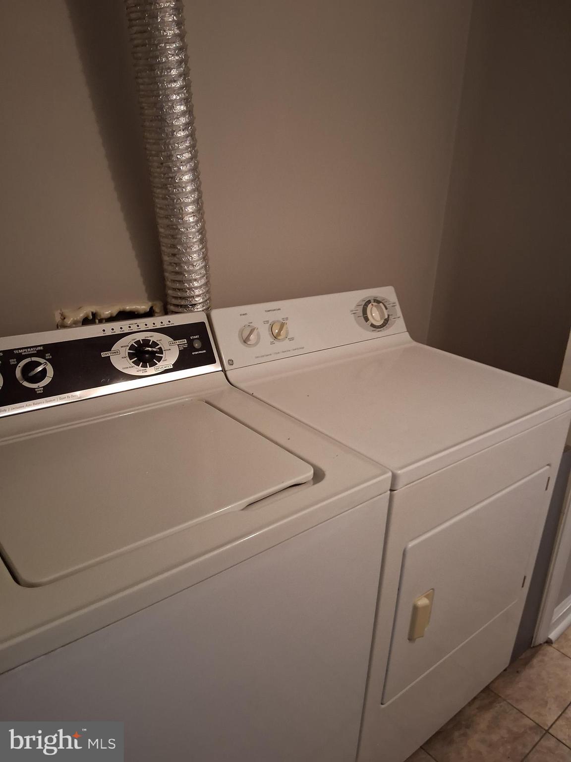 2305 Freetown Court, Unit 2B Reston, VA 20191 - Photo 12 of 15 a utility room with dryer and washer