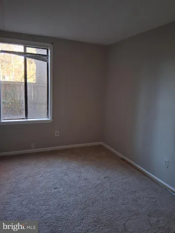 a bathroom with a shower a sink and mirror