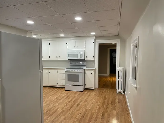 a bathroom with a shower and a toilet