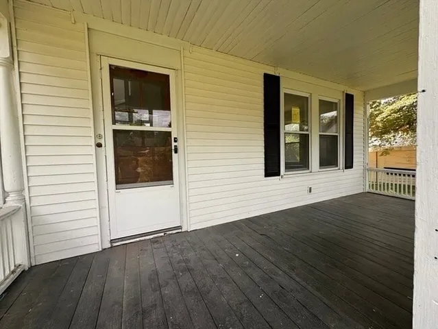 a view of an entryway of wooden house