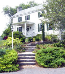 a front view of a house with a yard