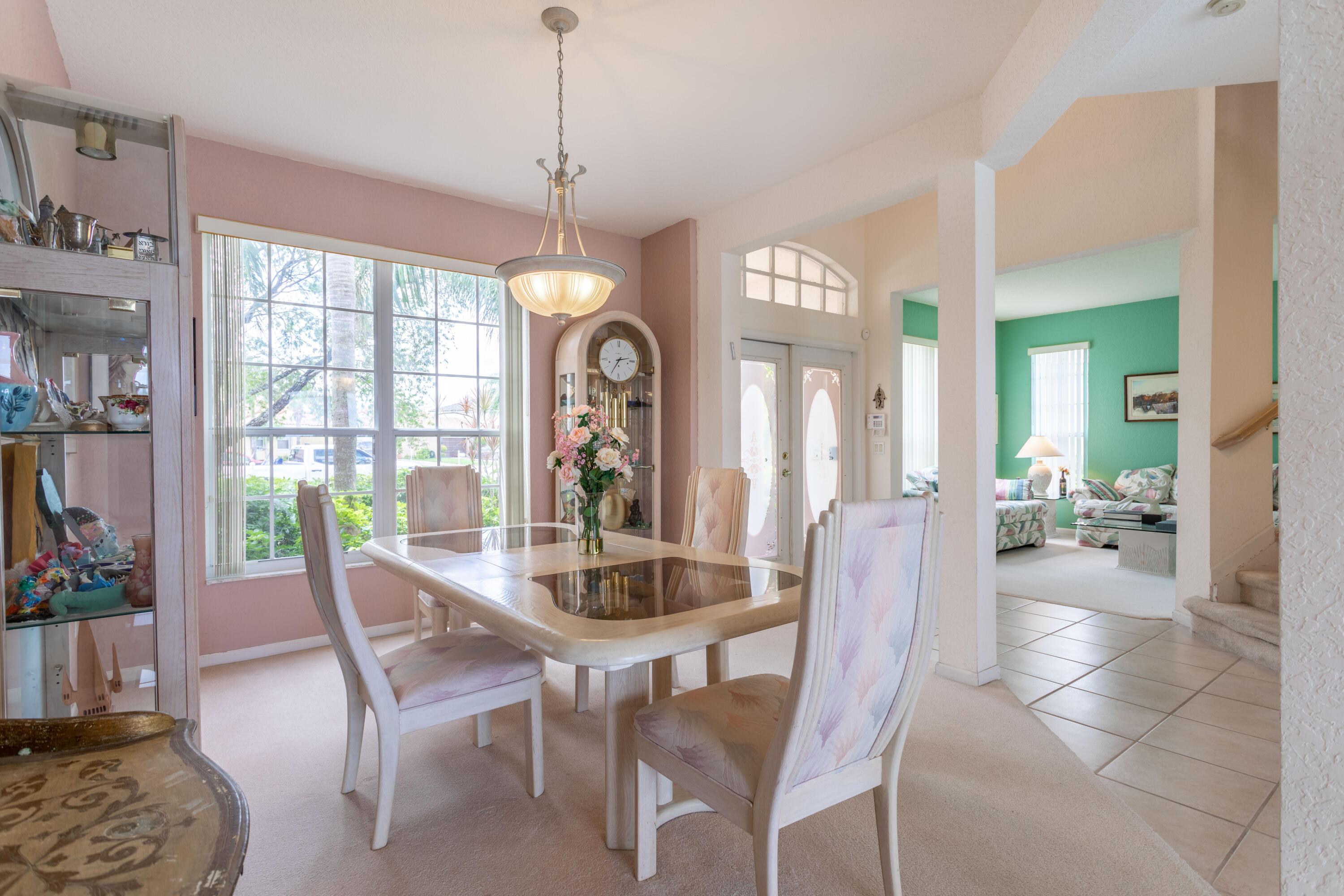 12601 Maypan Drive Boca Raton, FL 33428 - Photo 17 of 46 a dining room with furniture a chandelier and a rug