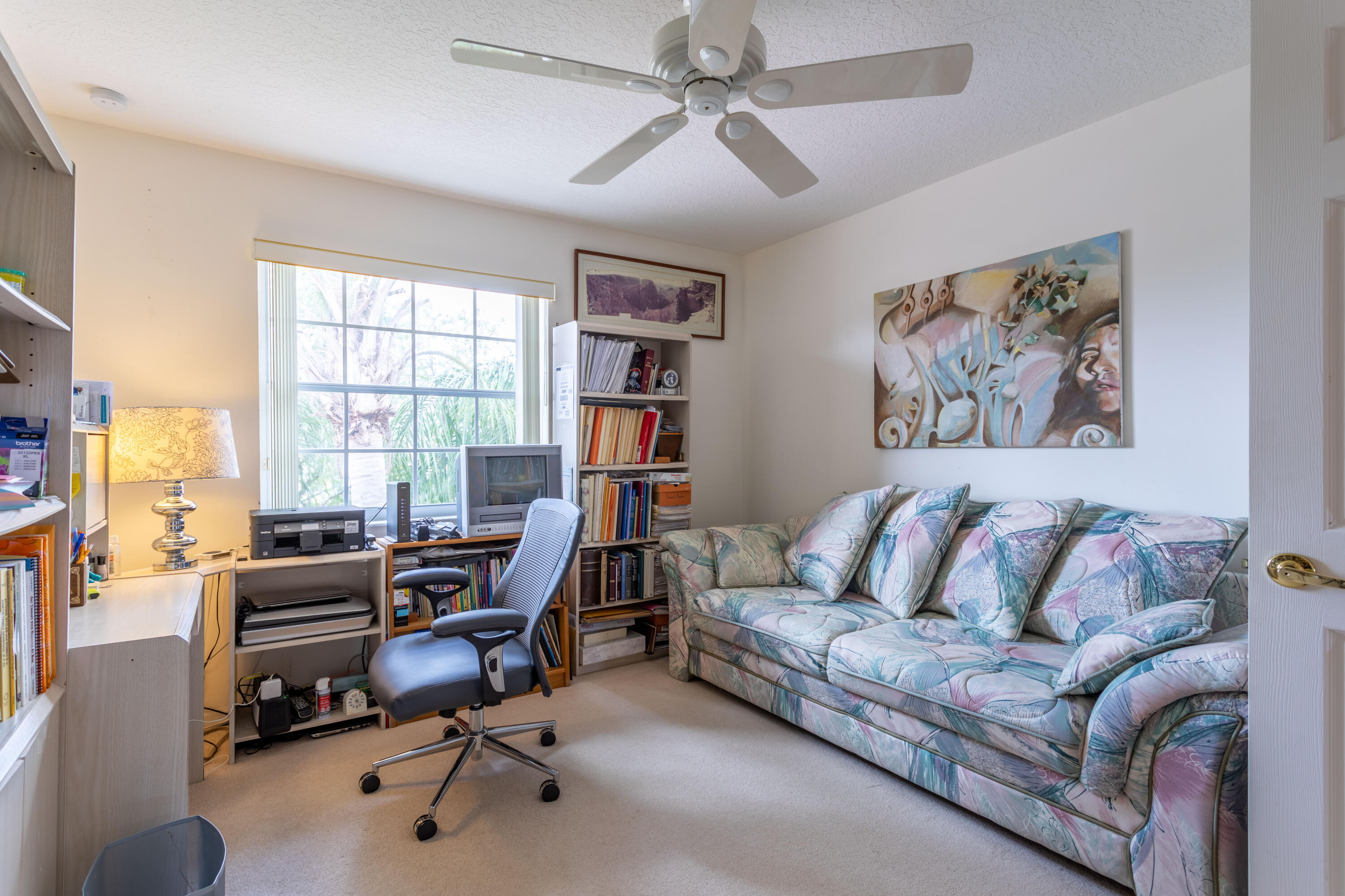12601 Maypan Drive Boca Raton, FL 33428 - Photo 20 of 46 a view of a livingroom with workspace and a couch