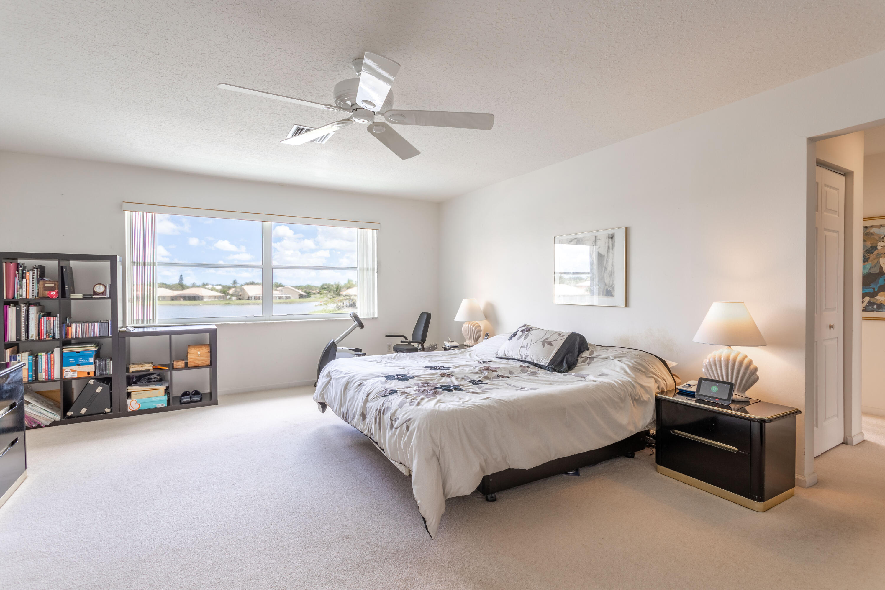 12601 Maypan Drive Boca Raton, FL 33428 - Photo 21 of 46 a bedroom with bed and window