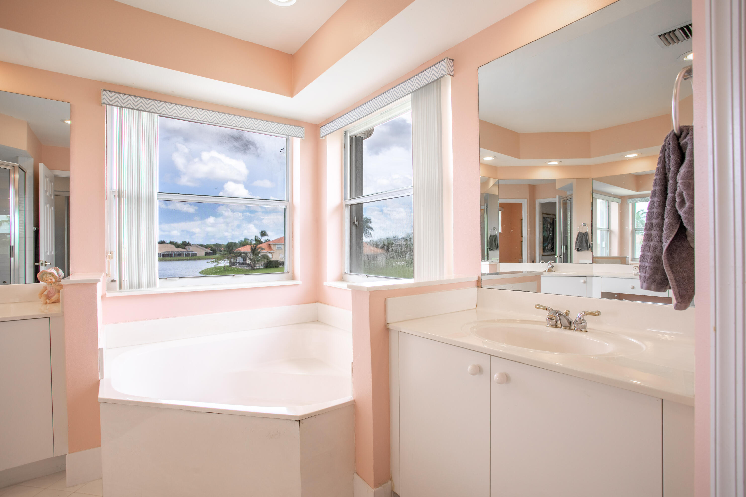 12601 Maypan Drive Boca Raton, FL 33428 - Photo 24 of 46 a bathroom with a sink and a large mirror