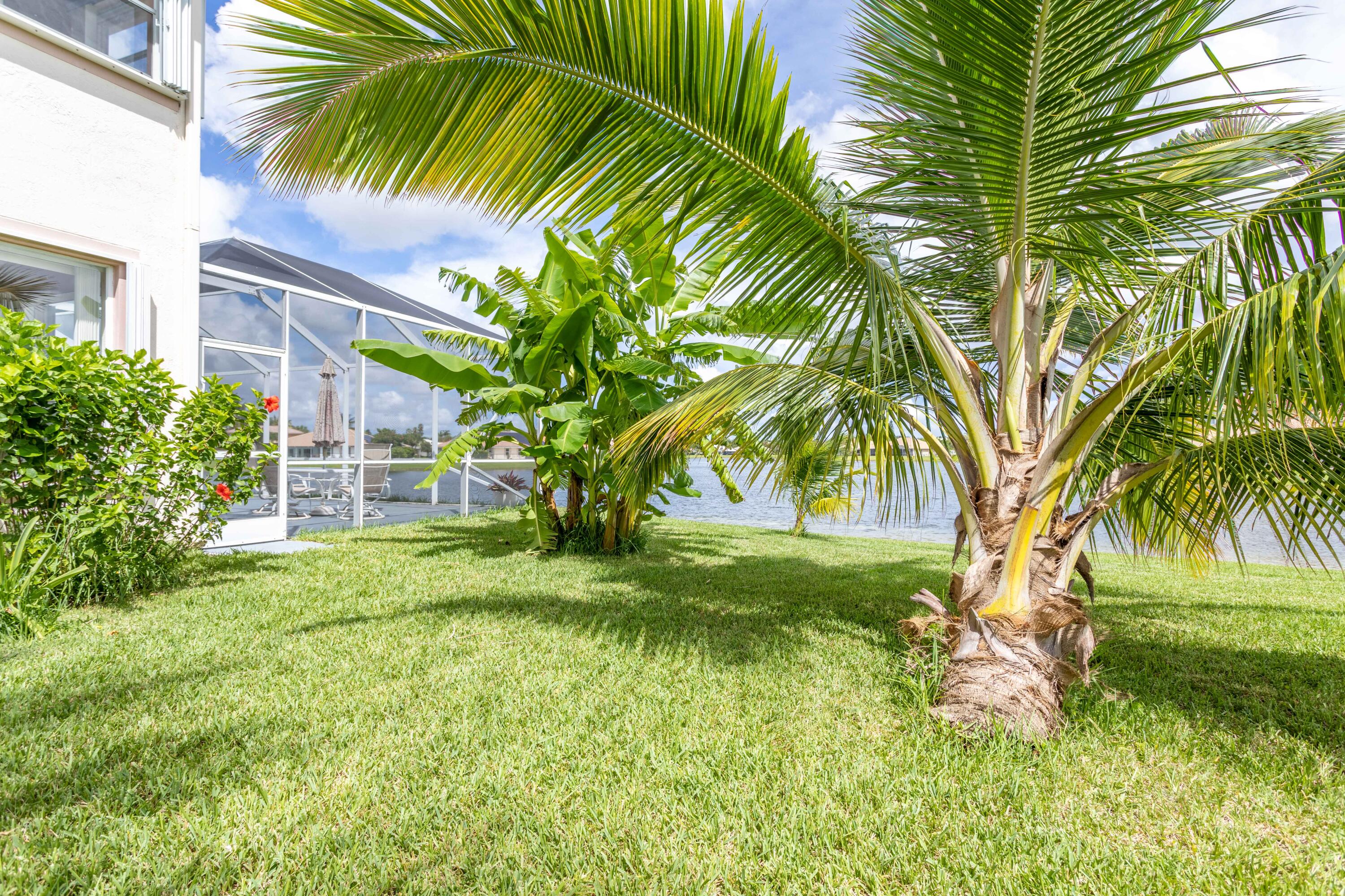 12601 Maypan Drive Boca Raton, FL 33428 - Photo 29 of 46 a view of a yard in front of a house