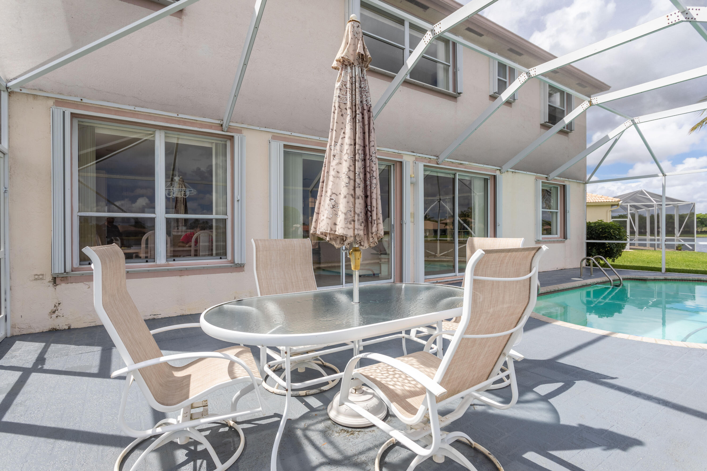 12601 Maypan Drive Boca Raton, FL 33428 - Photo 32 of 46 a view of a dining room with furniture wooden floor and a table