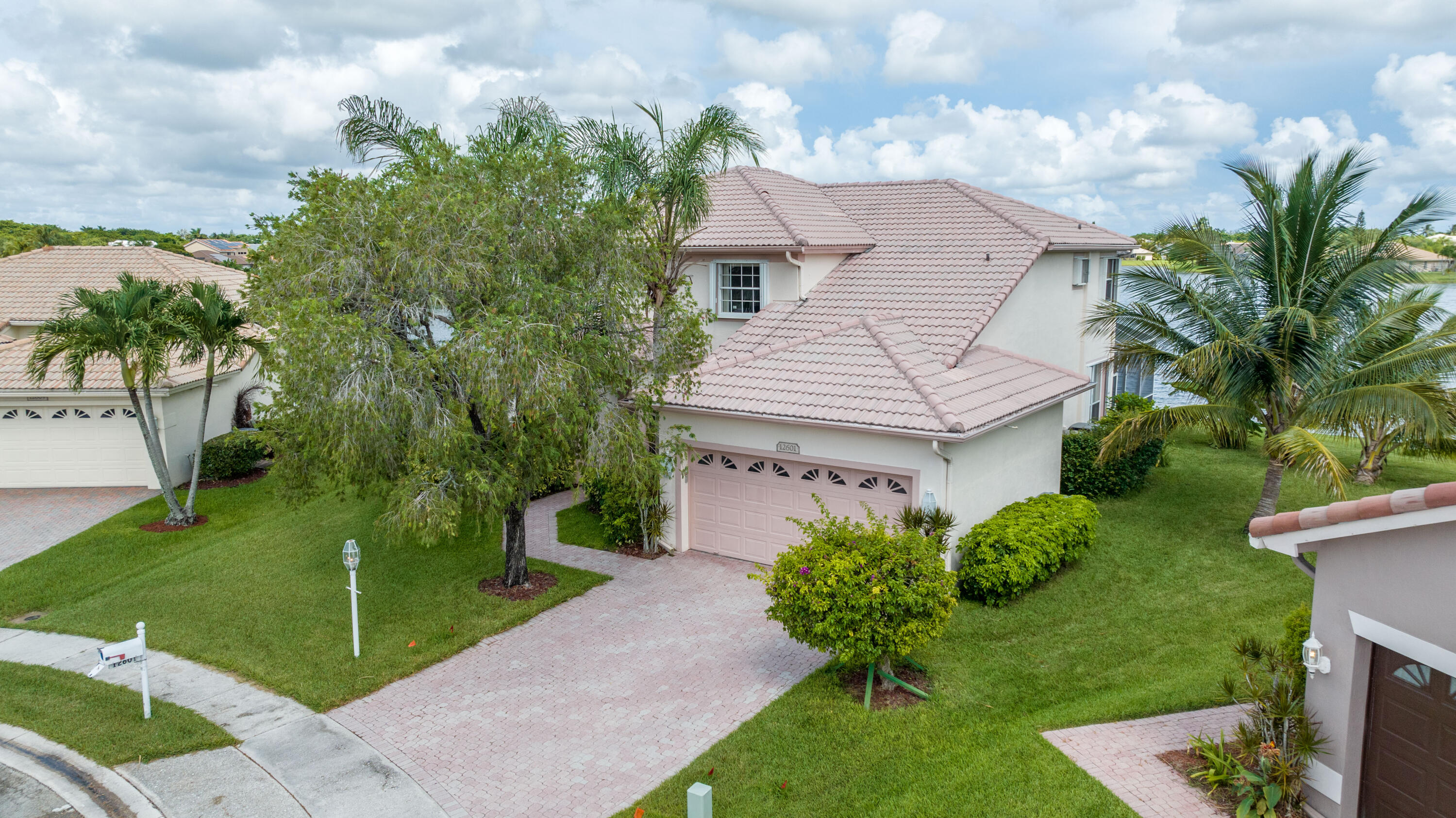 12601 Maypan Drive Boca Raton, FL 33428 - Photo 35 of 46 a front view of a house with garden