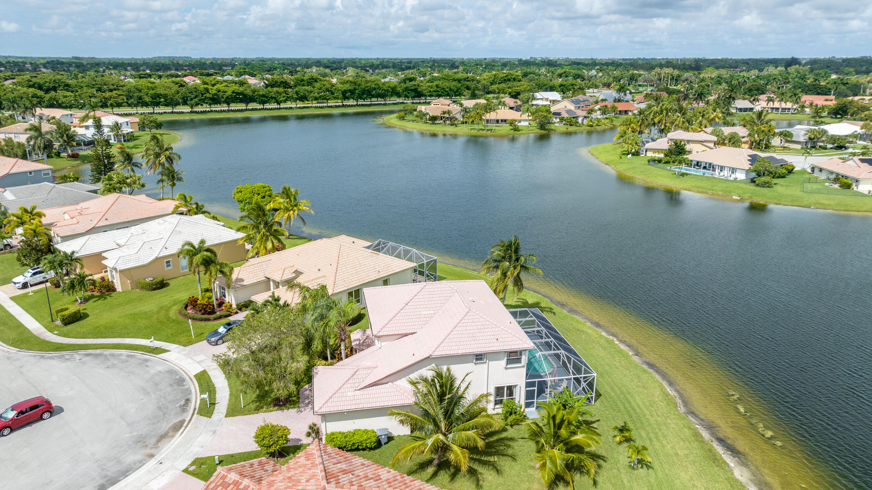 12601 Maypan Drive Boca Raton, FL 33428 - Photo 38 of 46 an aerial view of a house with a lake view