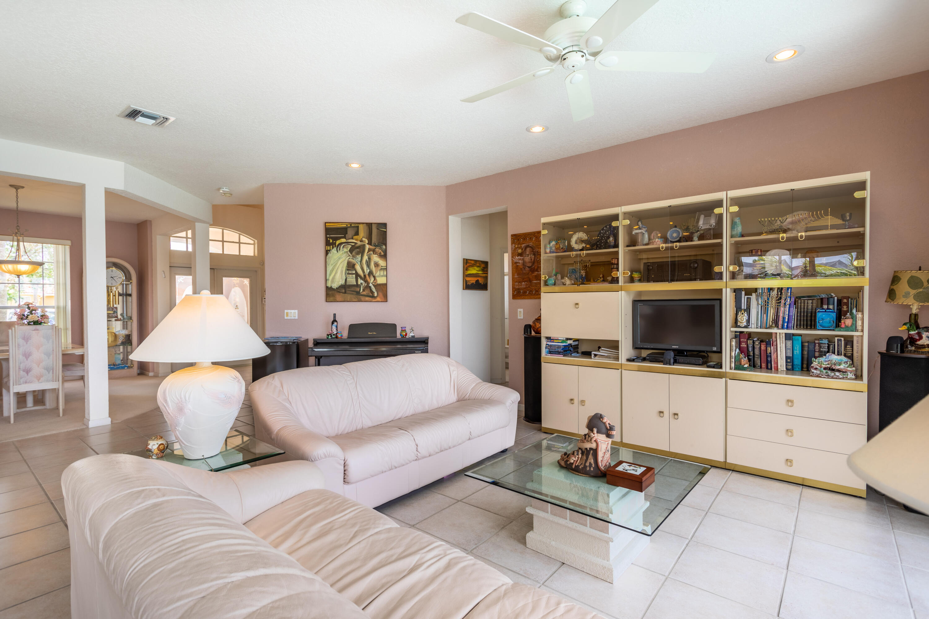 12601 Maypan Drive Boca Raton, FL 33428 - Photo 9 of 46 a living room with furniture and a flat screen tv