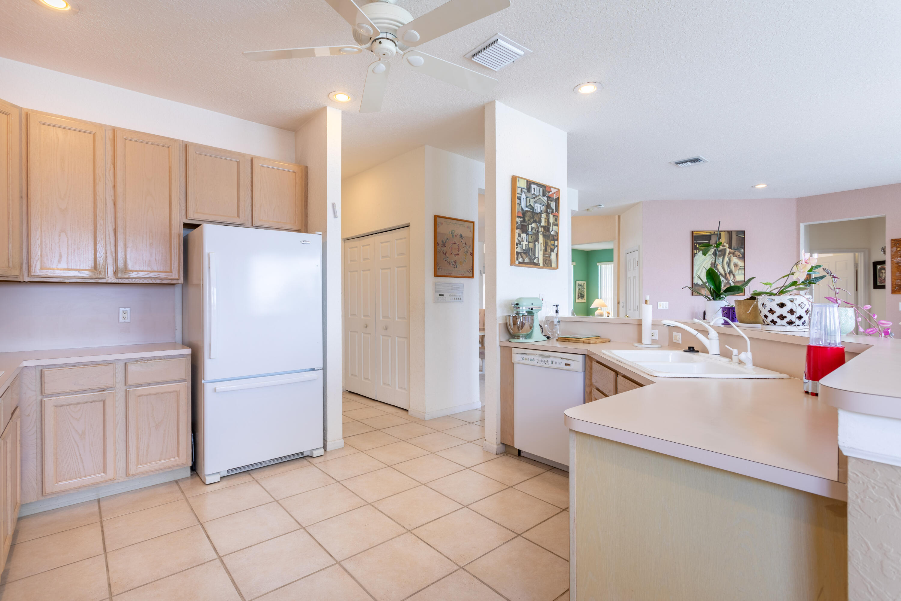 12601 Maypan Drive Boca Raton, FL 33428 - Photo 10 of 46 a kitchen with a refrigerator and a sink