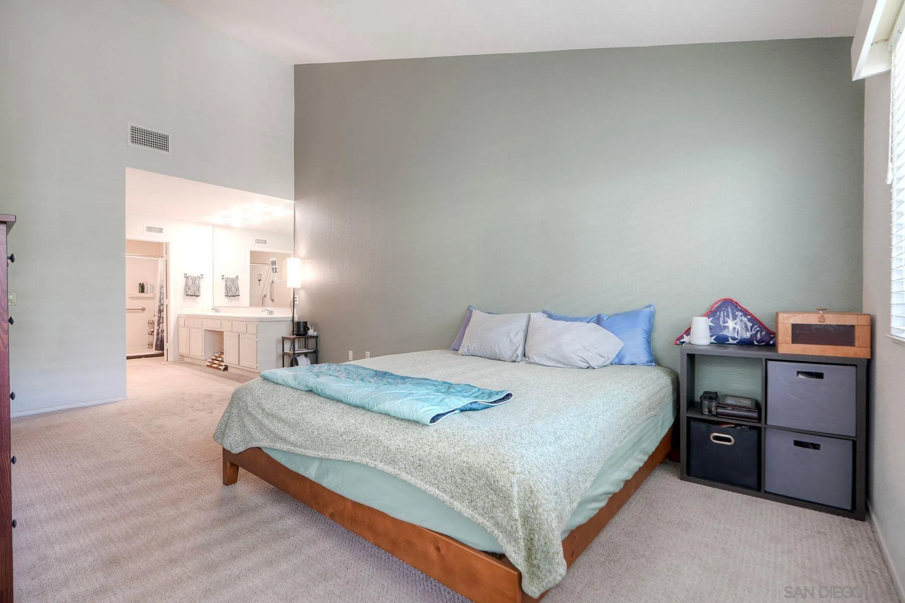 29414 Circle R Greens Drive Escondido, CA 92026 - Photo 14 of 34 a bedroom with a bed and a chandelier