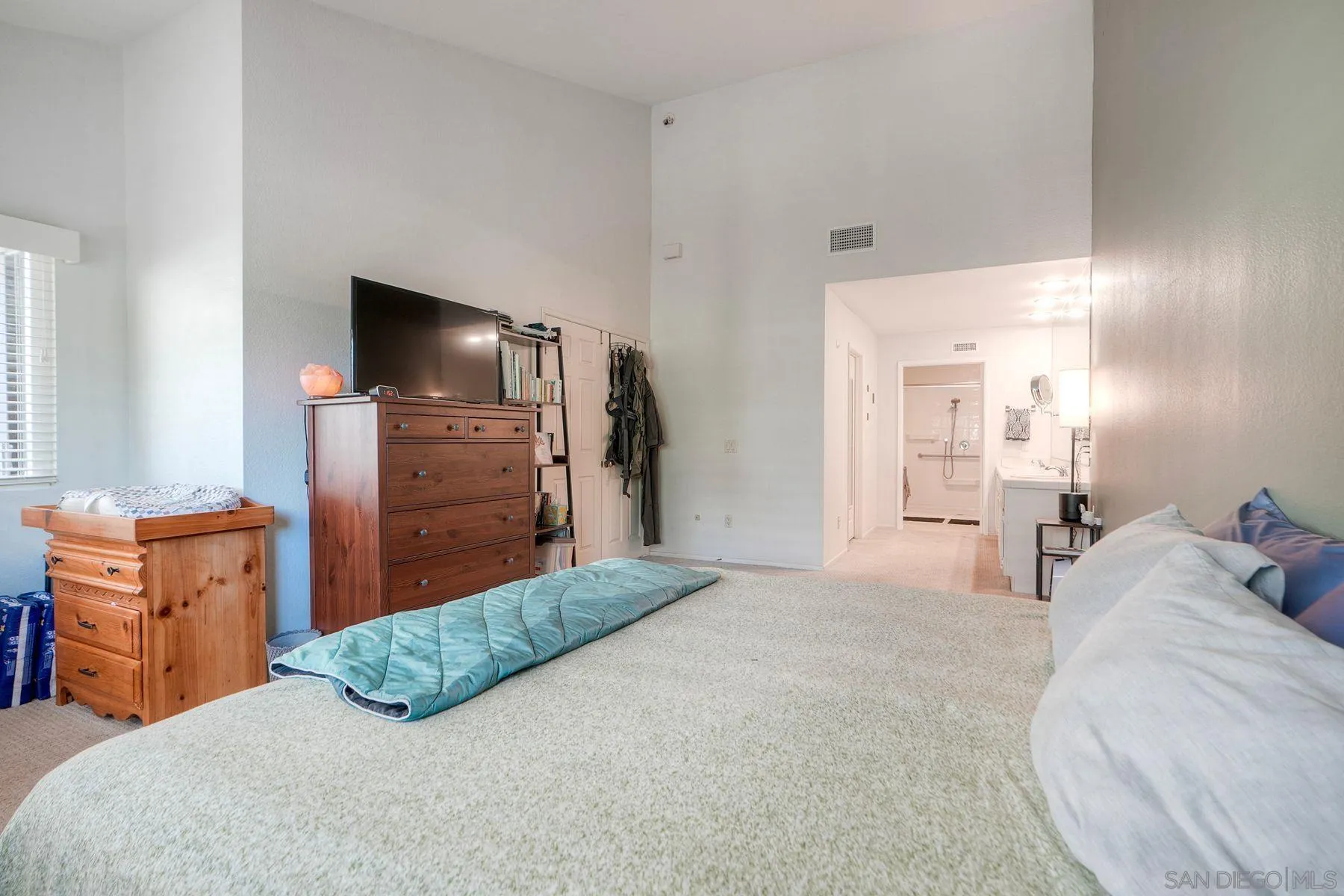 29414 Circle R Greens Drive Escondido, CA 92026 - Photo 15 of 34 a bedroom with a bed and flat screen tv