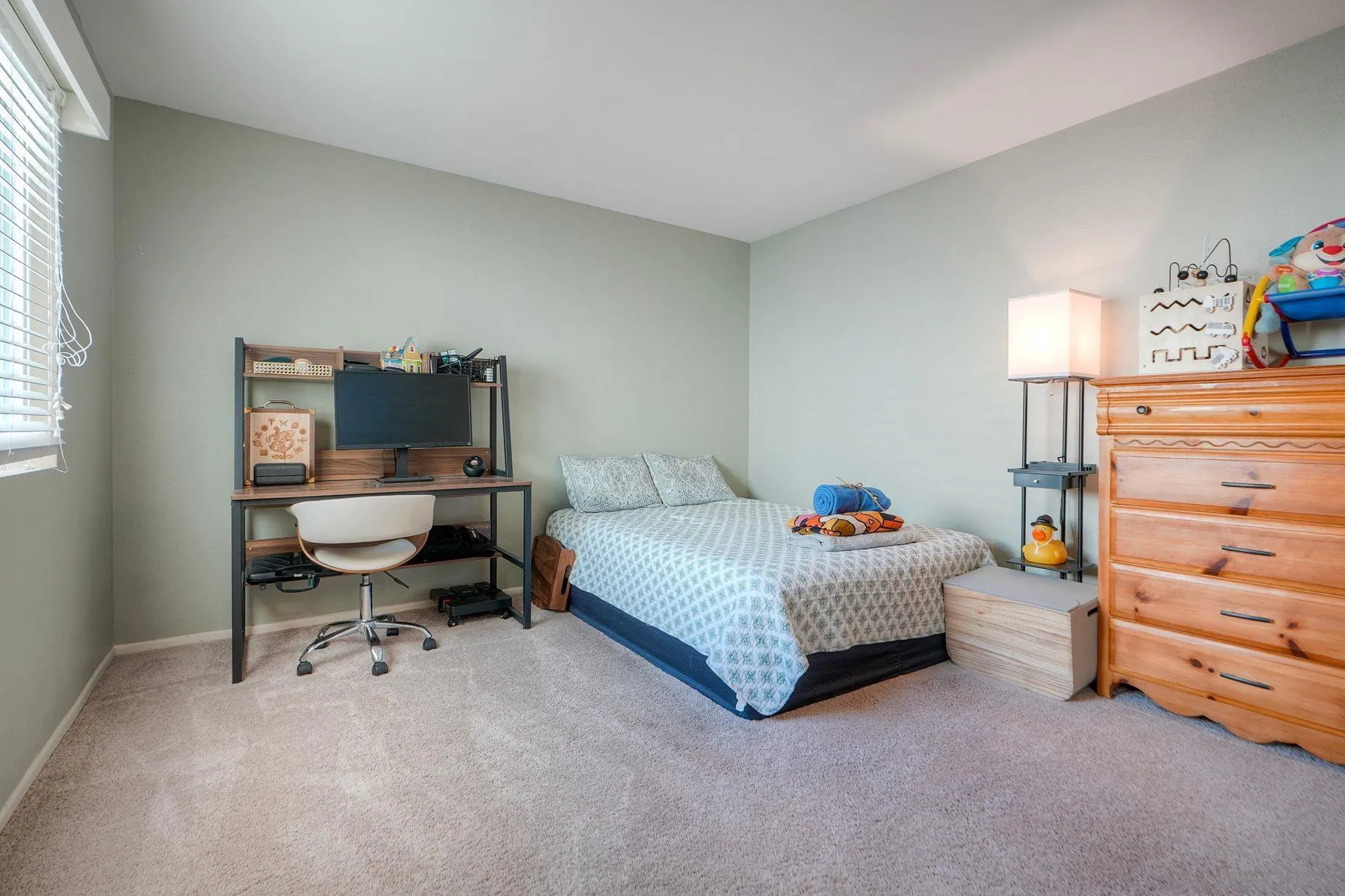 29414 Circle R Greens Drive Escondido, CA 92026 - Photo 16 of 34 a room with a baby bed a couch and a window