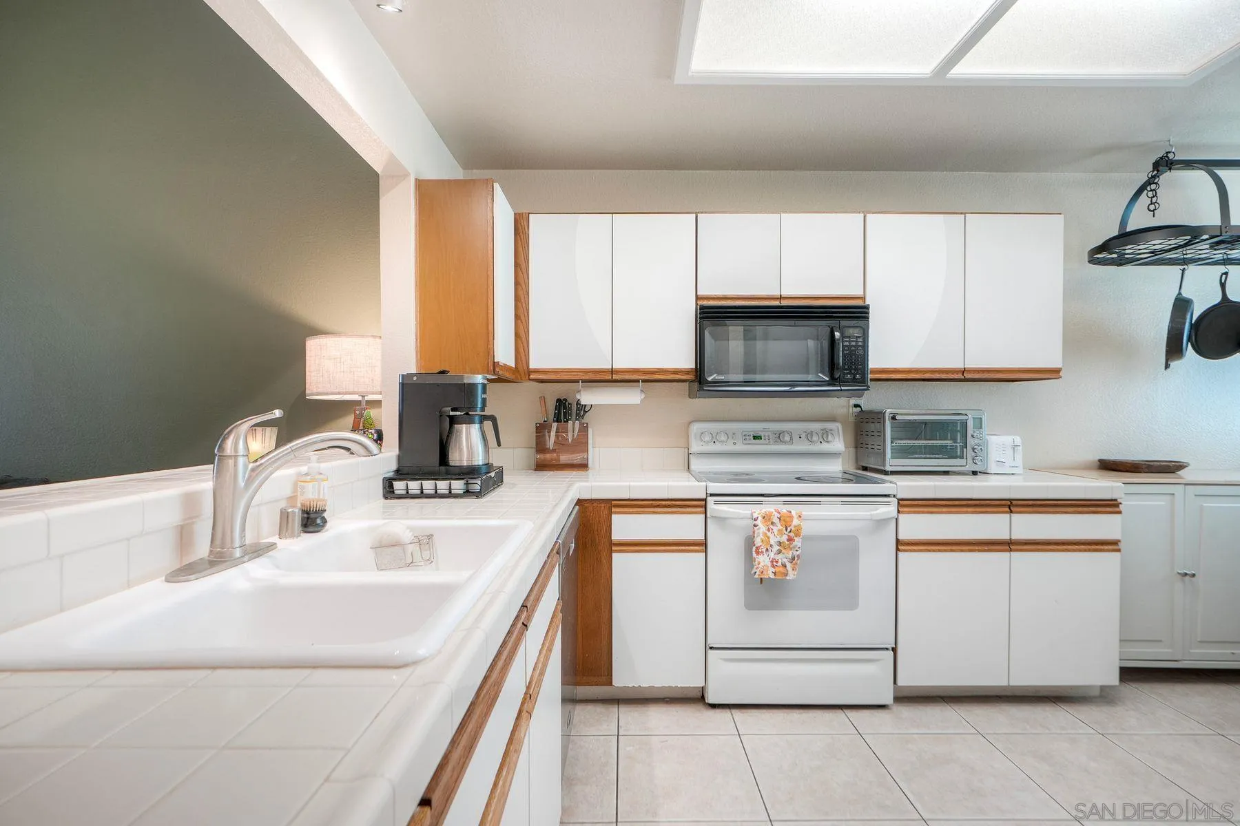 29414 Circle R Greens Drive Escondido, CA 92026 - Photo 5 of 34 a kitchen with stainless steel appliances granite countertop a sink and a stove