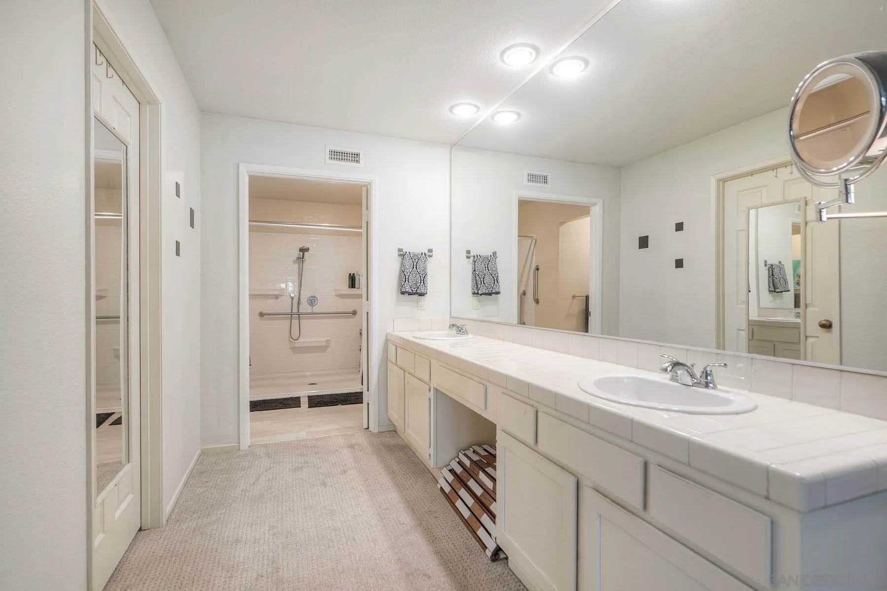 29414 Circle R Greens Drive Escondido, CA 92026 - Photo 10 of 34 a spacious bathroom with a granite countertop sink mirror and a shower
