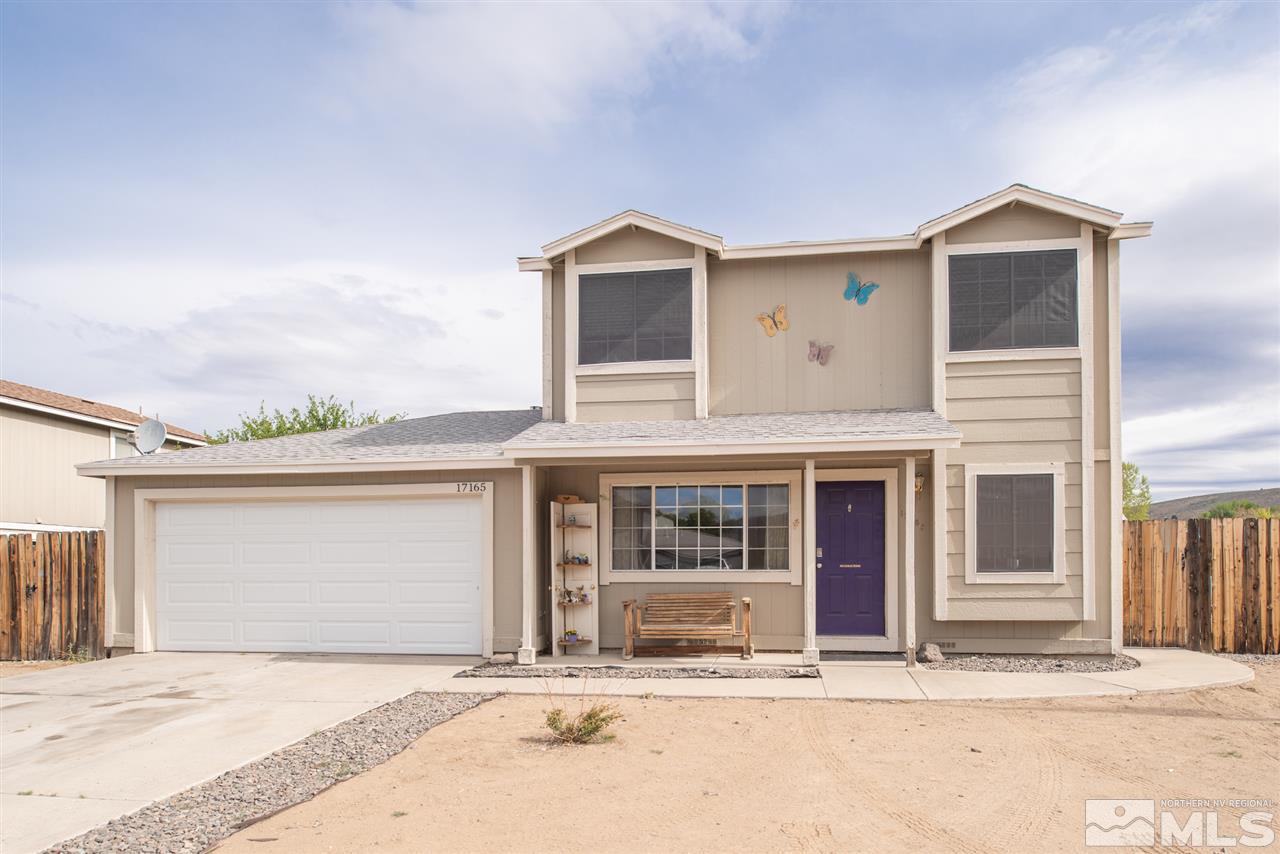 17165 Touraco Street Reno, NV 89508 - Photo 1 of 24 a front view of a house with a garage and a window