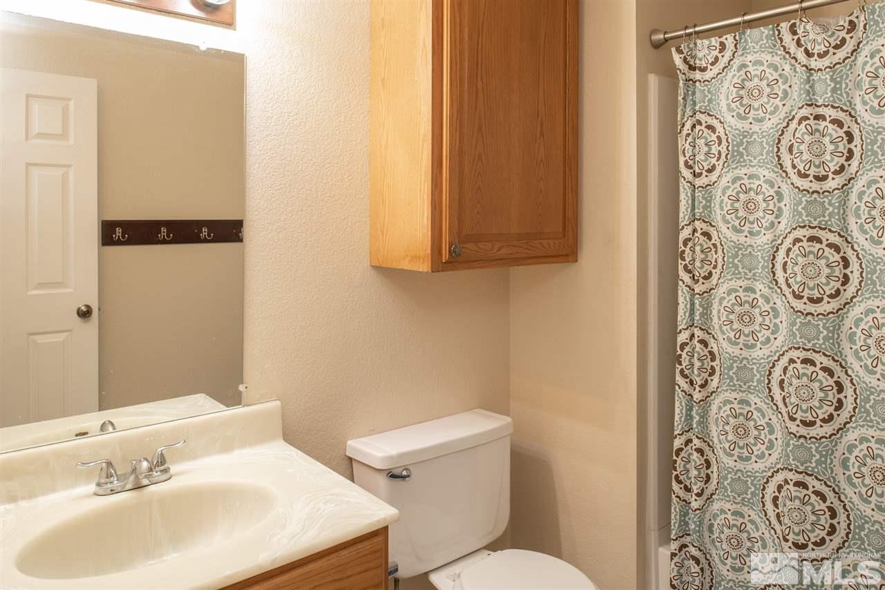 17165 Touraco Street Reno, NV 89508 - Photo 13 of 24 a bathroom with a sink and a toilet