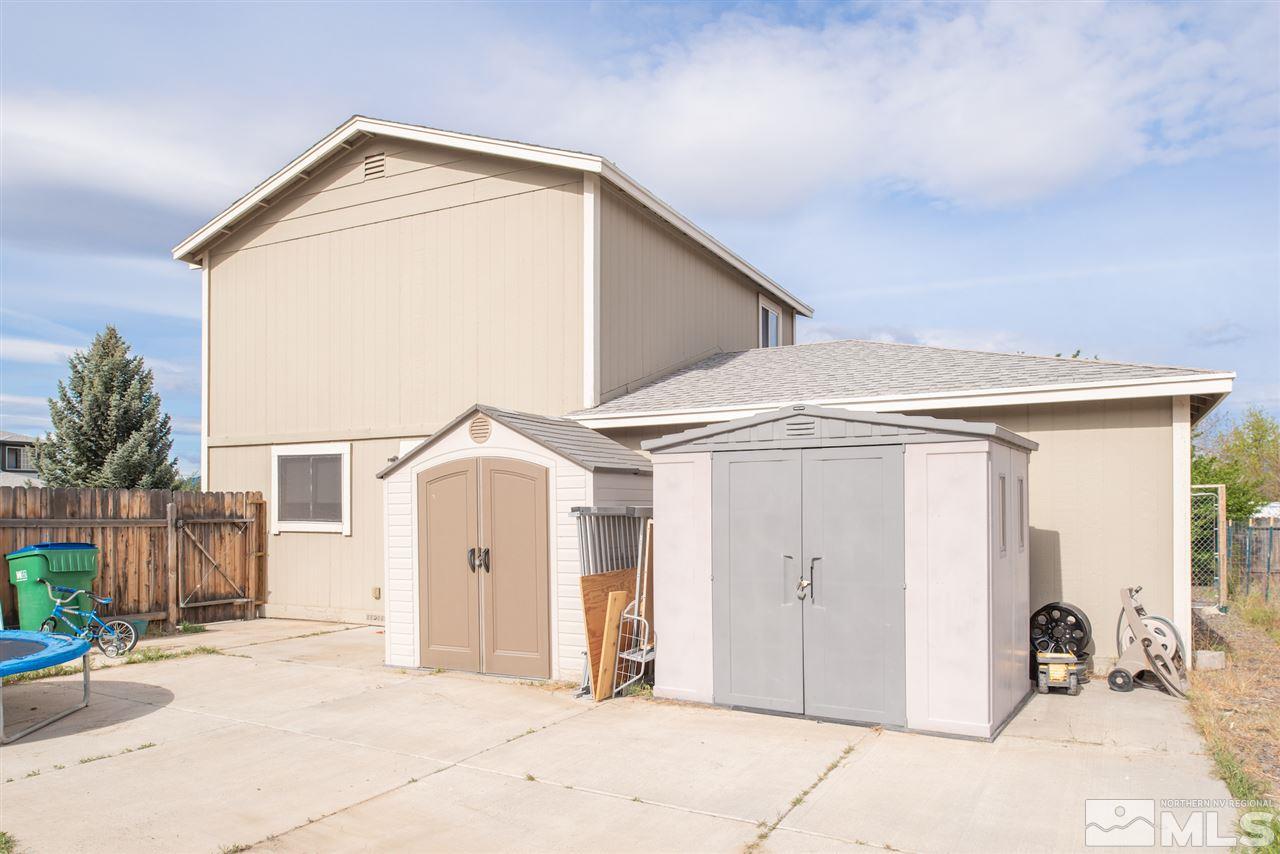 17165 Touraco Street Reno, NV 89508 - Photo 15 of 24 a front view of a house with a garage