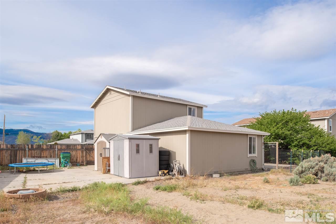 17165 Touraco Street Reno, NV 89508 - Photo 16 of 24 a view of a house with a yard