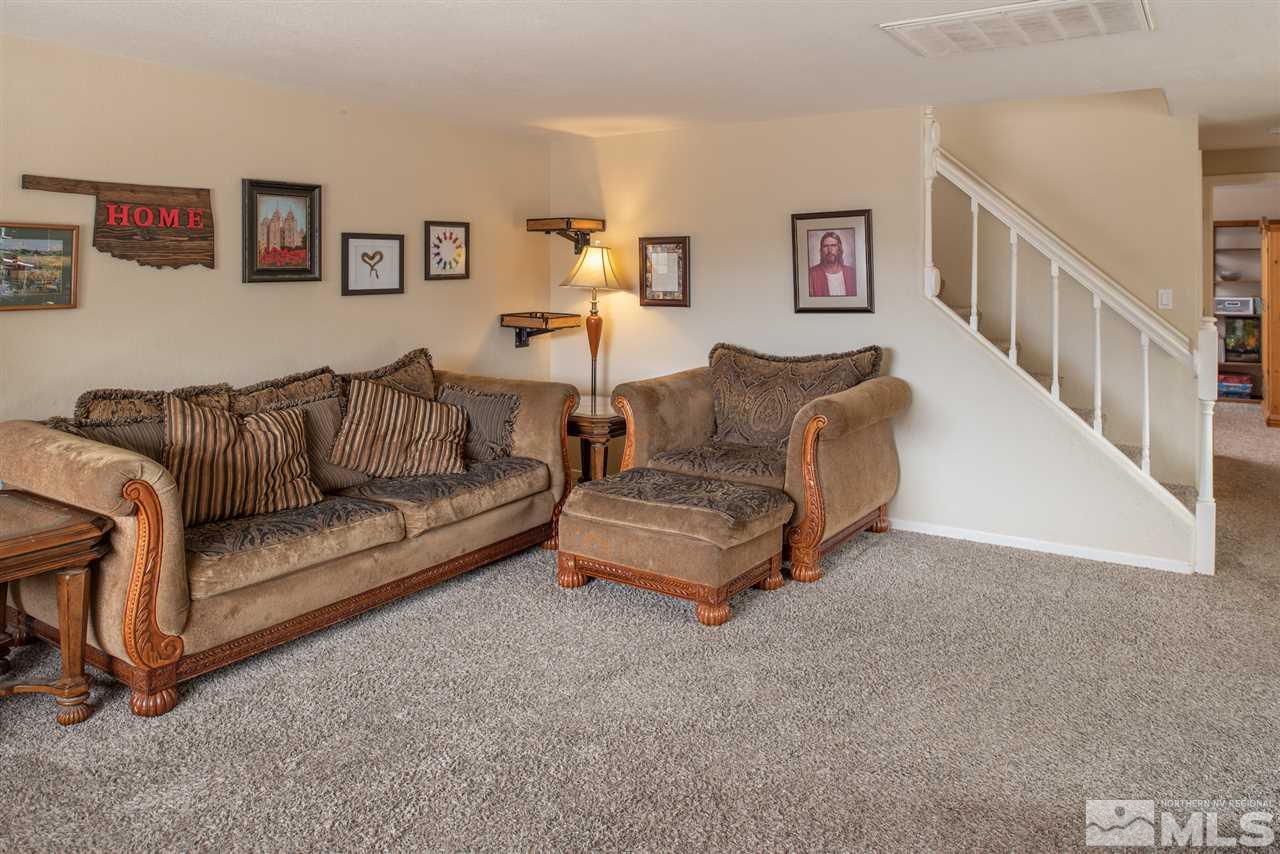 17165 Touraco Street Reno, NV 89508 - Photo 3 of 24 a living room with furniture and a couch