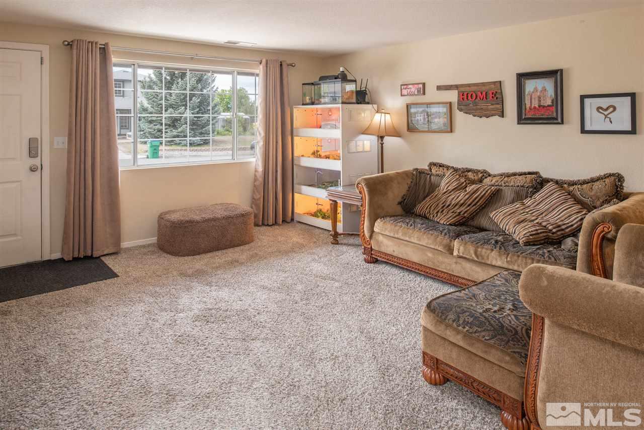 17165 Touraco Street Reno, NV 89508 - Photo 4 of 24 a living room with furniture and a window