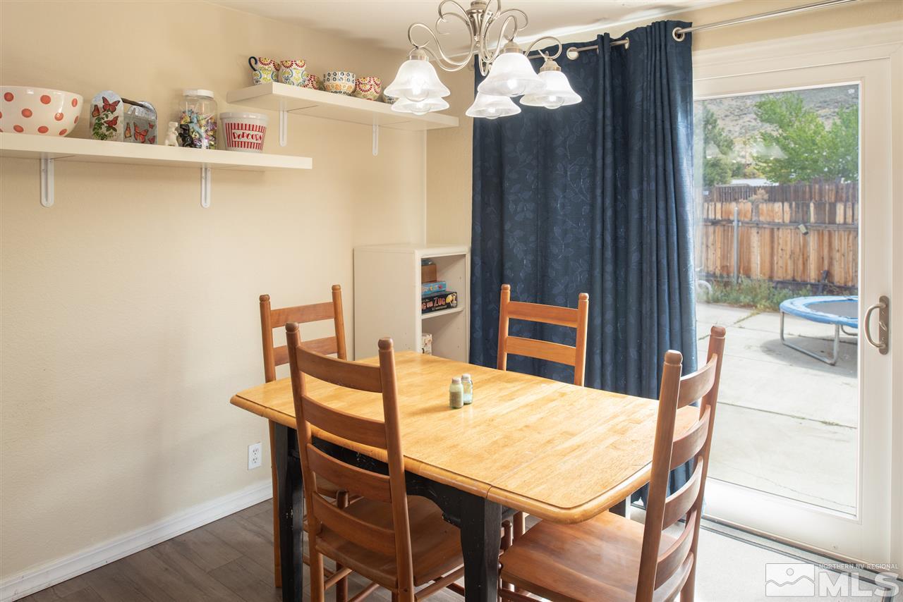 17165 Touraco Street Reno, NV 89508 - Photo 8 of 24 a view of a dining room with furniture and window