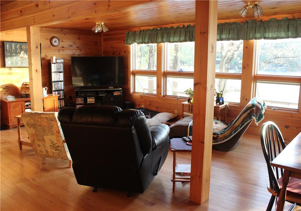 188 Sand Pond Road Chesterville, ME 04938 - Photo 10 of 24 Living area that overlooks the water.