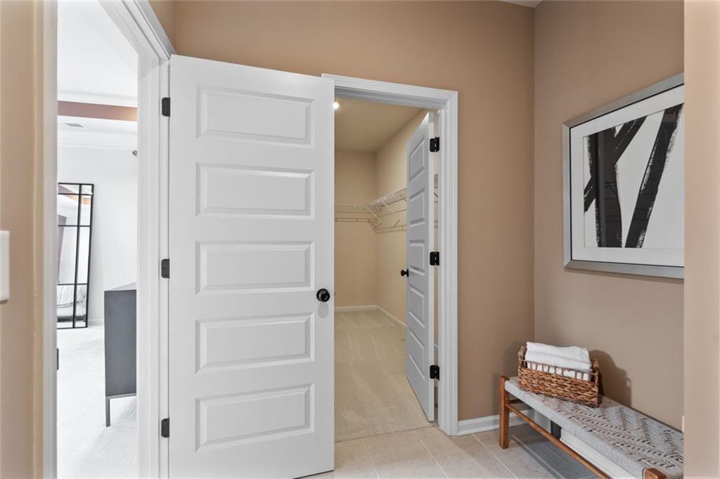 310 Caroline Place, Unit 100 Villa Rica, GA 30180 - Photo 26 of 30 a room that has a bed and a window in it