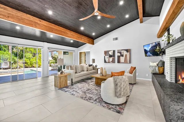 a spacious bedroom with a bed and a couch