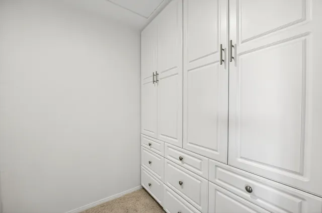 a view of a livingroom with furniture and a window