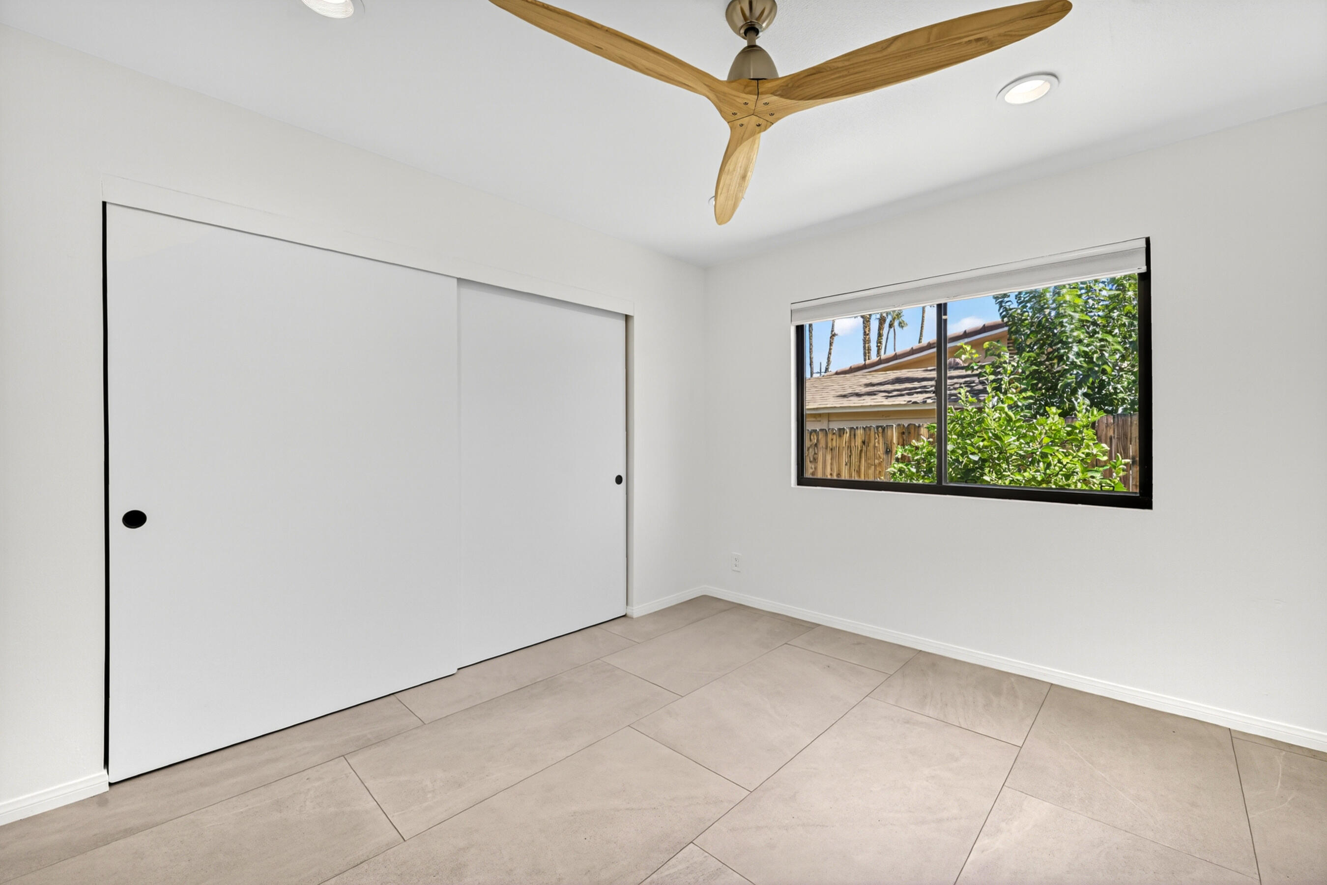 74090 Setting Sun Trail Palm Desert, CA 92260 - Photo 23 of 46 a view of an empty room with a window