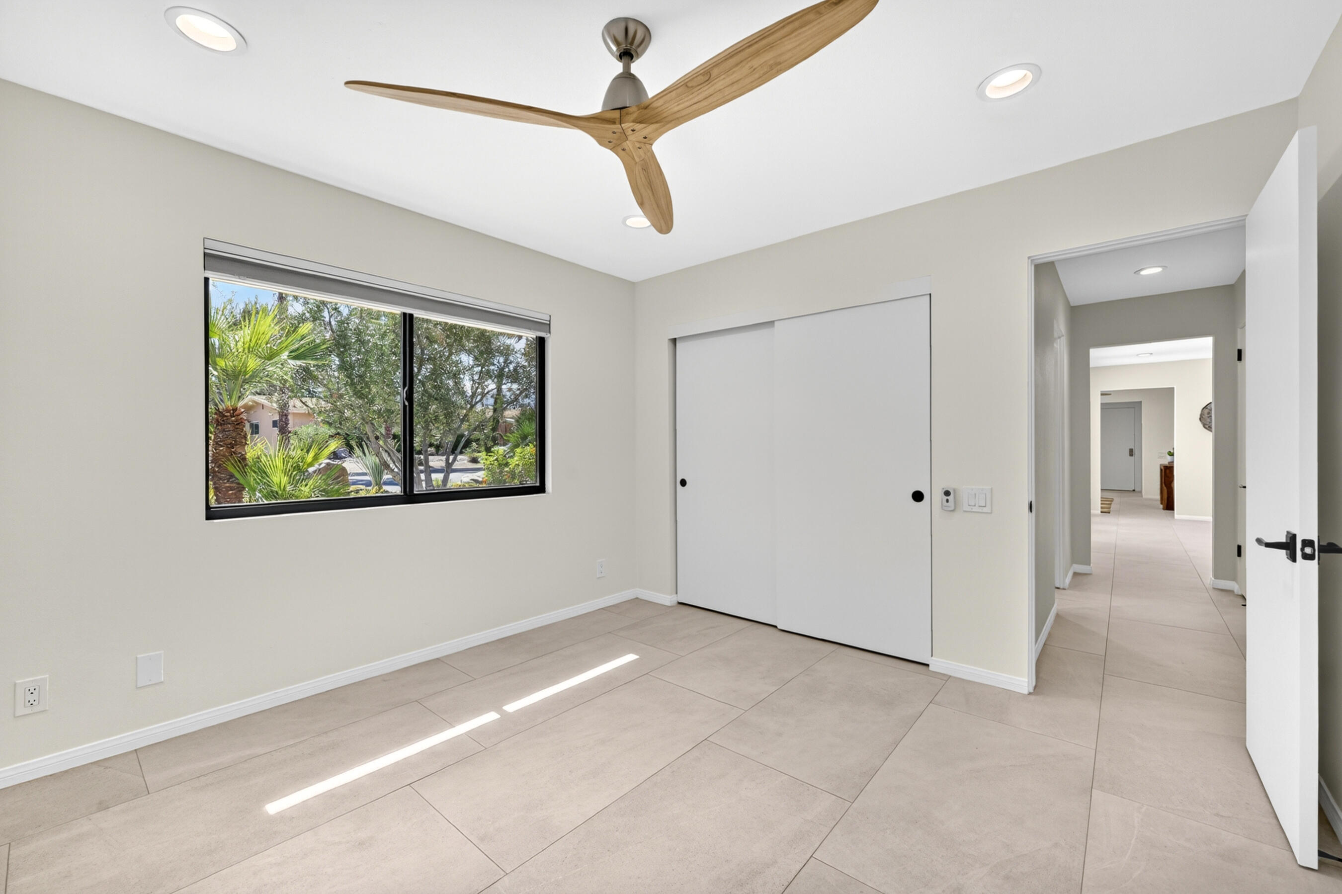 74090 Setting Sun Trail Palm Desert, CA 92260 - Photo 25 of 46 a view of an empty room with a window