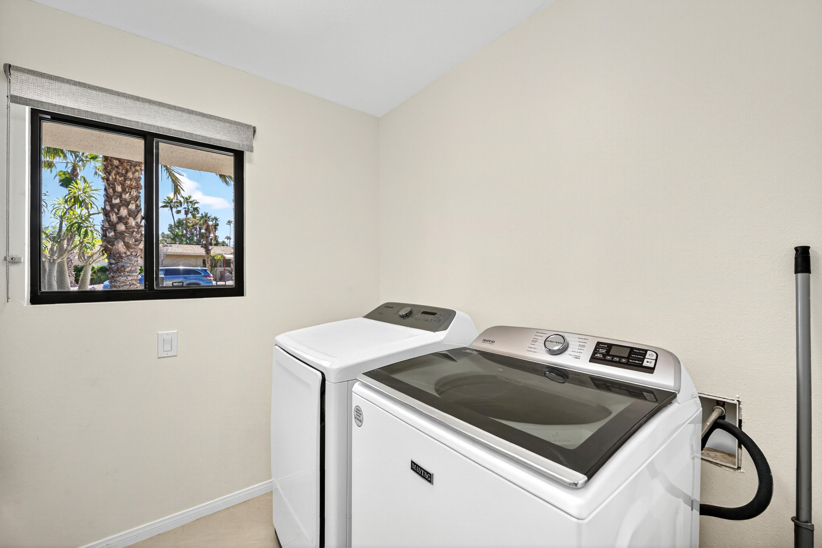 74090 Setting Sun Trail Palm Desert, CA 92260 - Photo 26 of 46 a utility room with dryer and washer