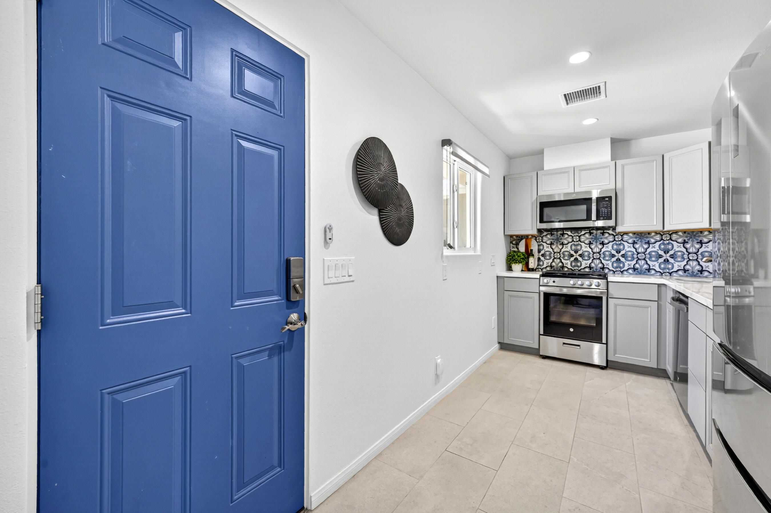 74090 Setting Sun Trail Palm Desert, CA 92260 - Photo 32 of 46 a kitchen with stainless steel appliances granite countertop a stove and a sink
